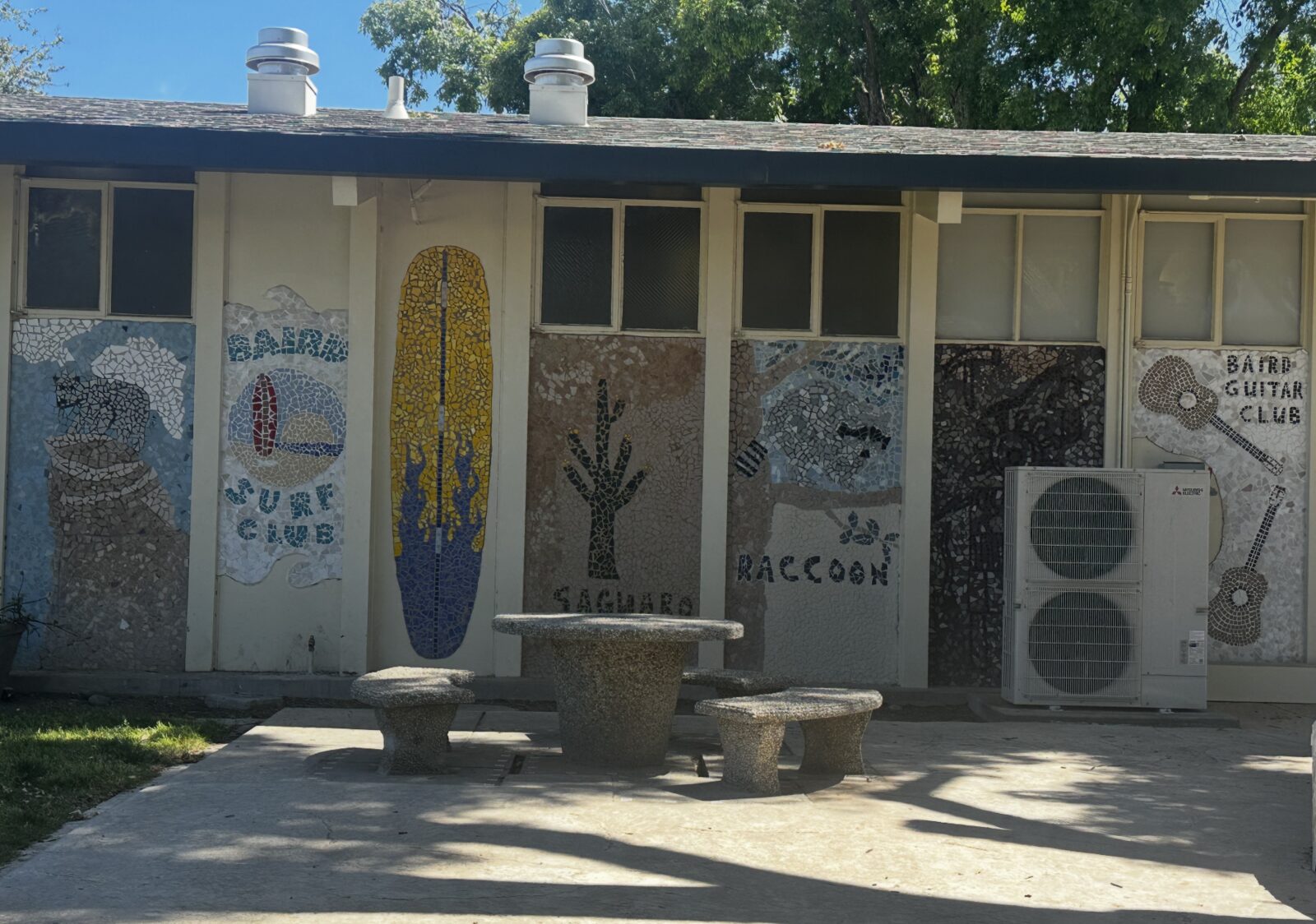 Student club murals including Surf Club and Guitar Club